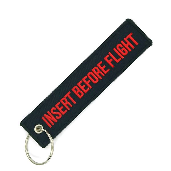Klíčenka INSERT BEFORE FLIGHT černá