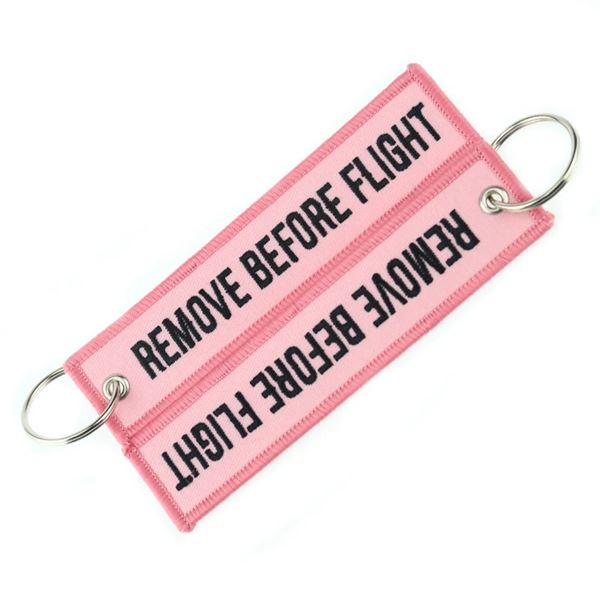 Klíčenka REMOVE BEFORE FLIGHT světle růžová
